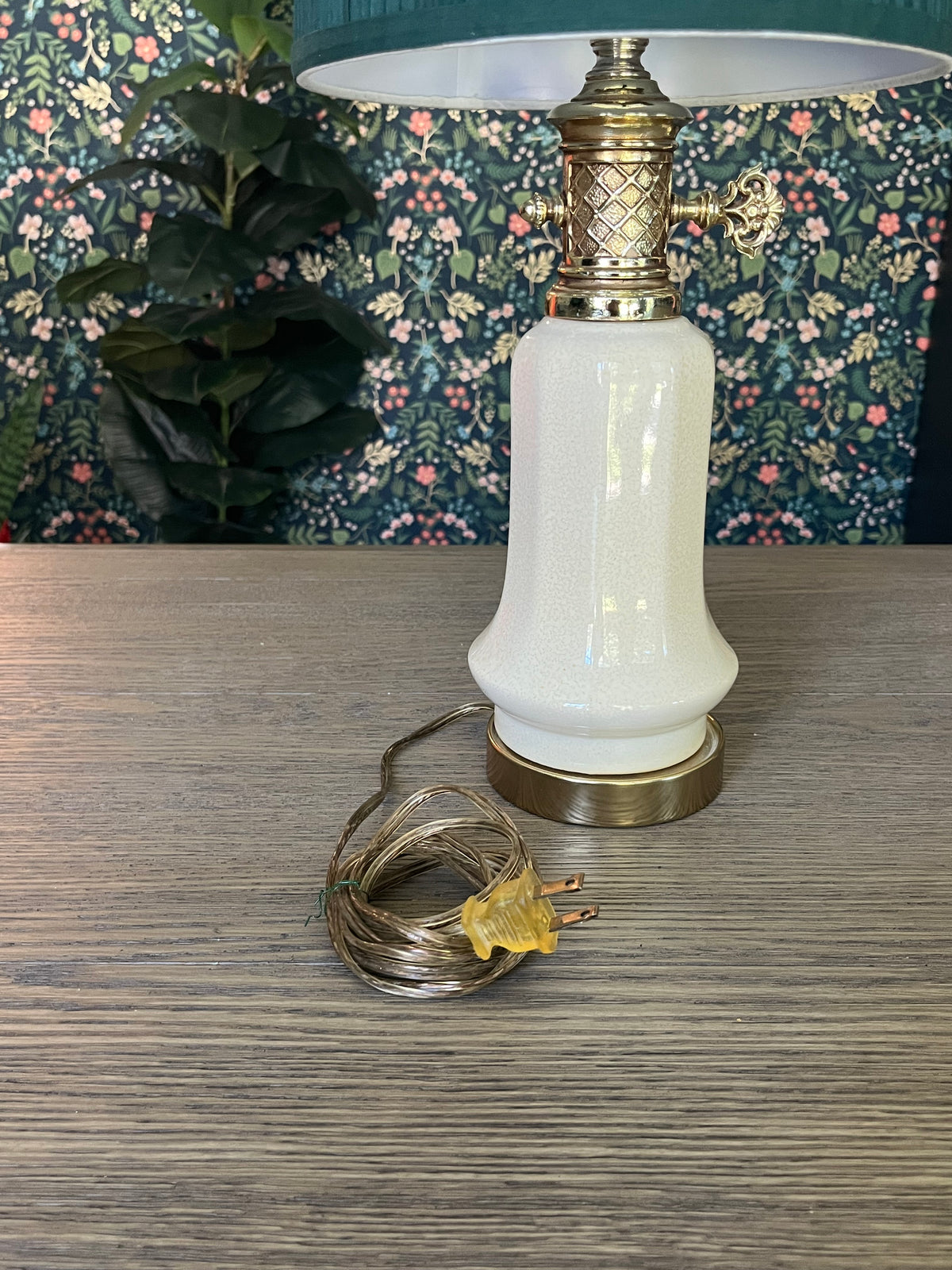 Vintage table lamp with a green pleated shade