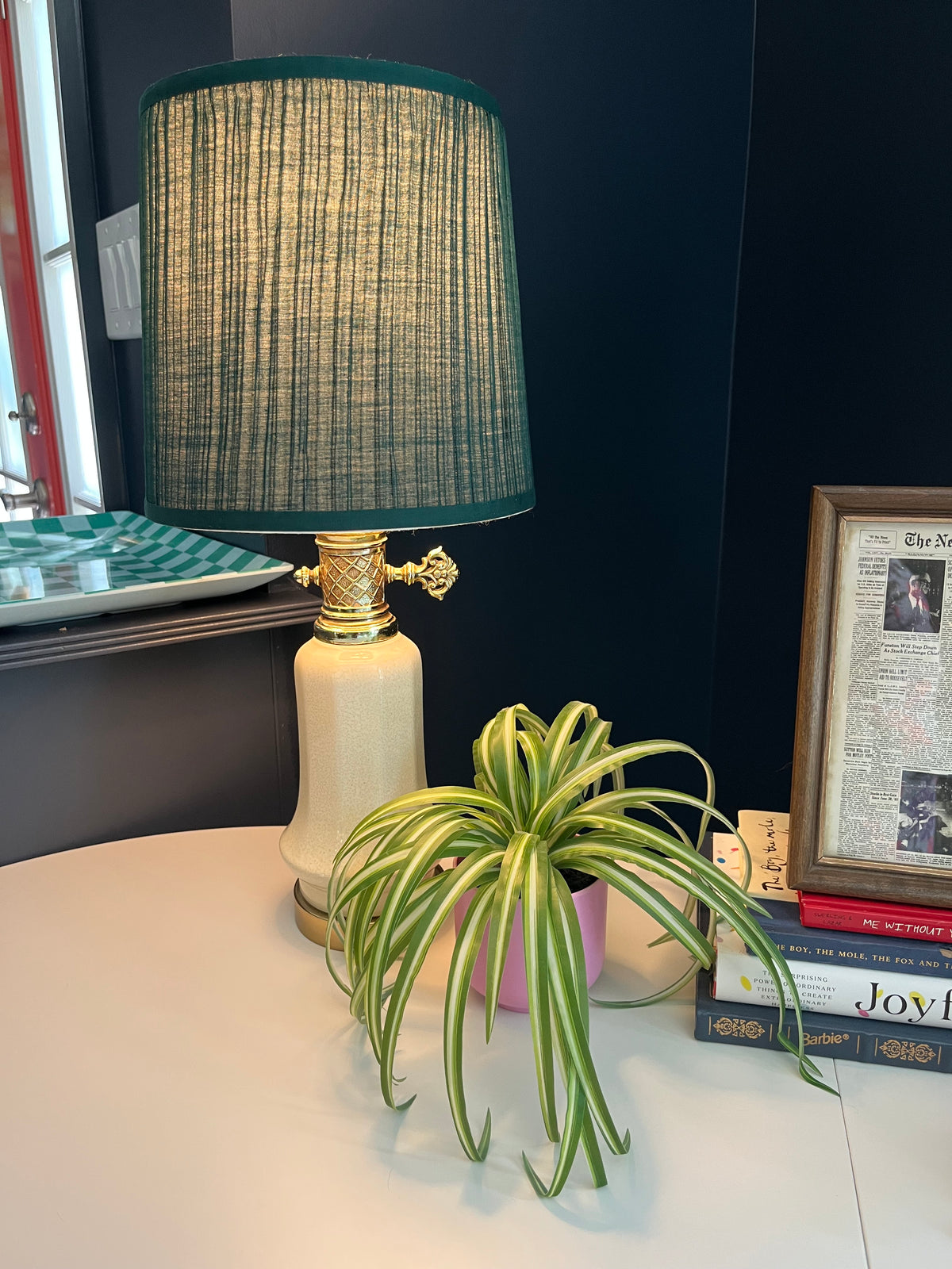 Vintage table lamp with a green pleated shade