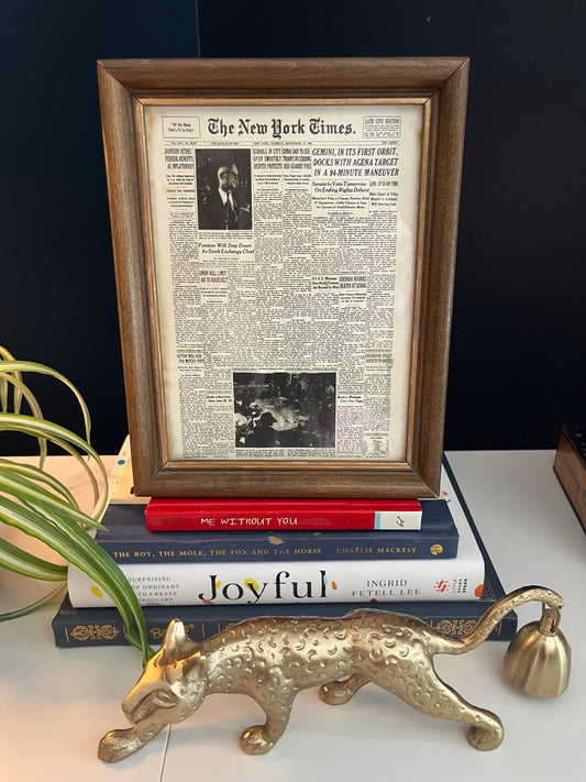 Vintage New York Times print in a gold frame