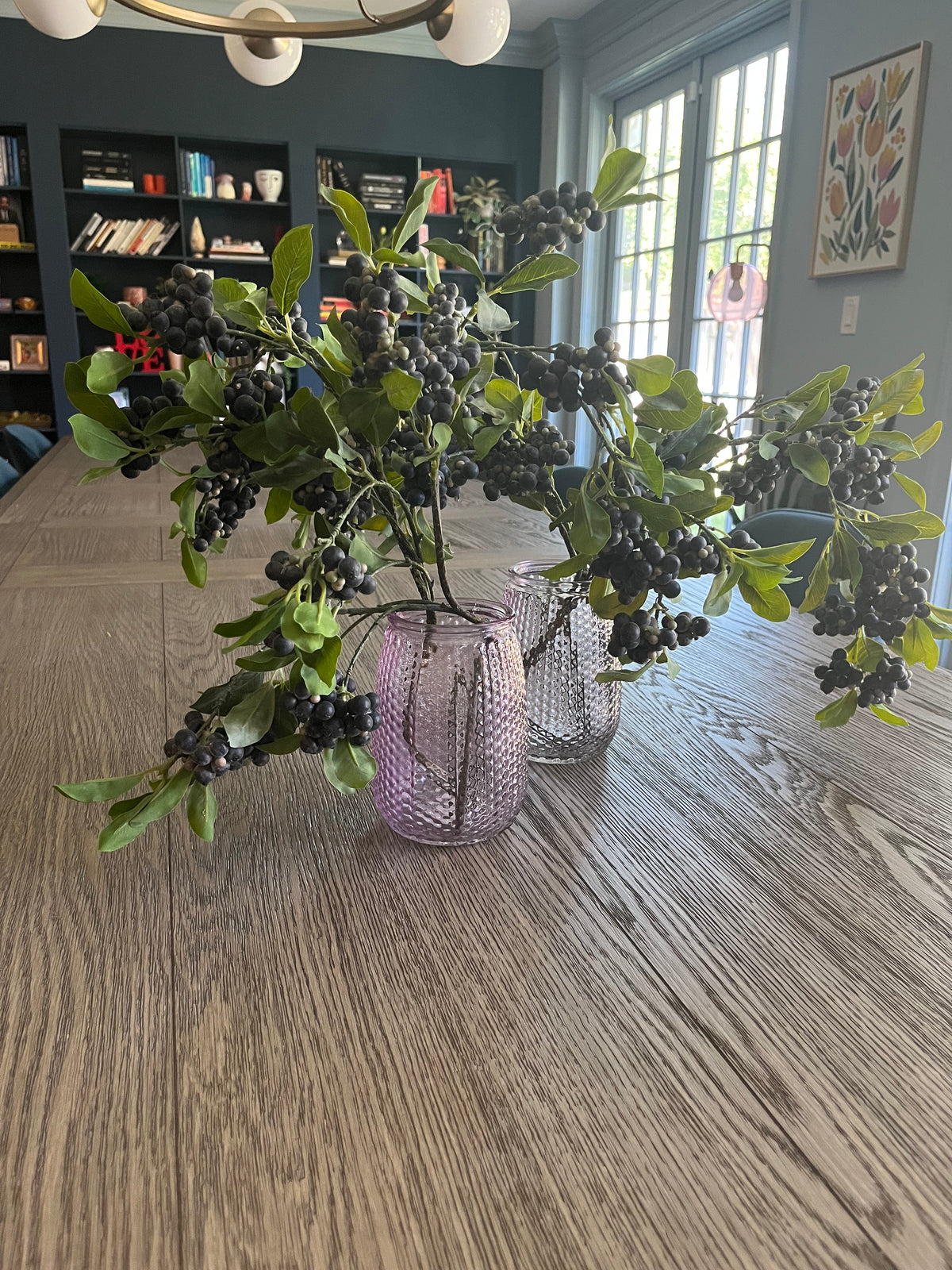 Pair of mauve glass vases with blueberry branches