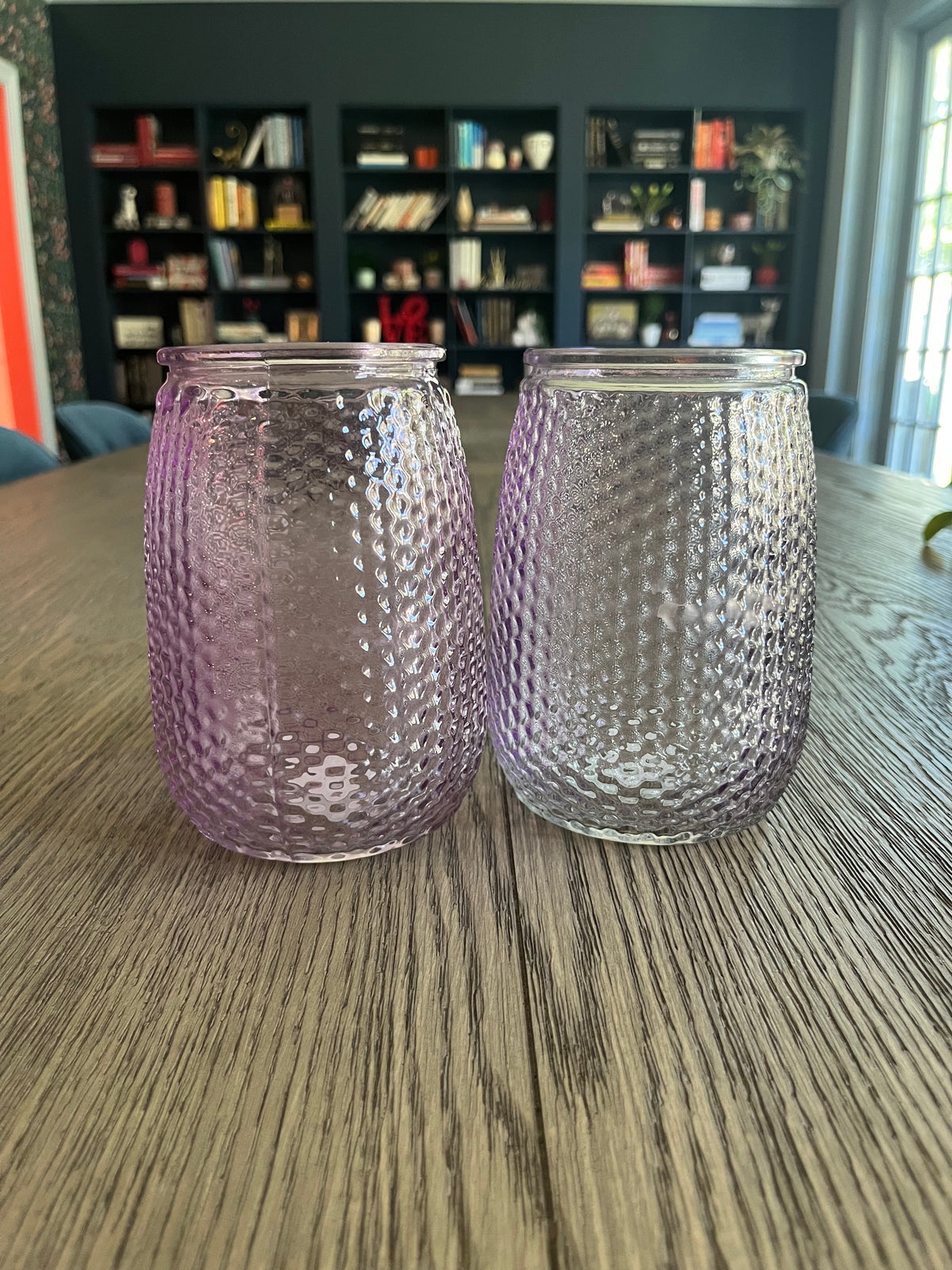 Pair of mauve glass vases with blueberry branches