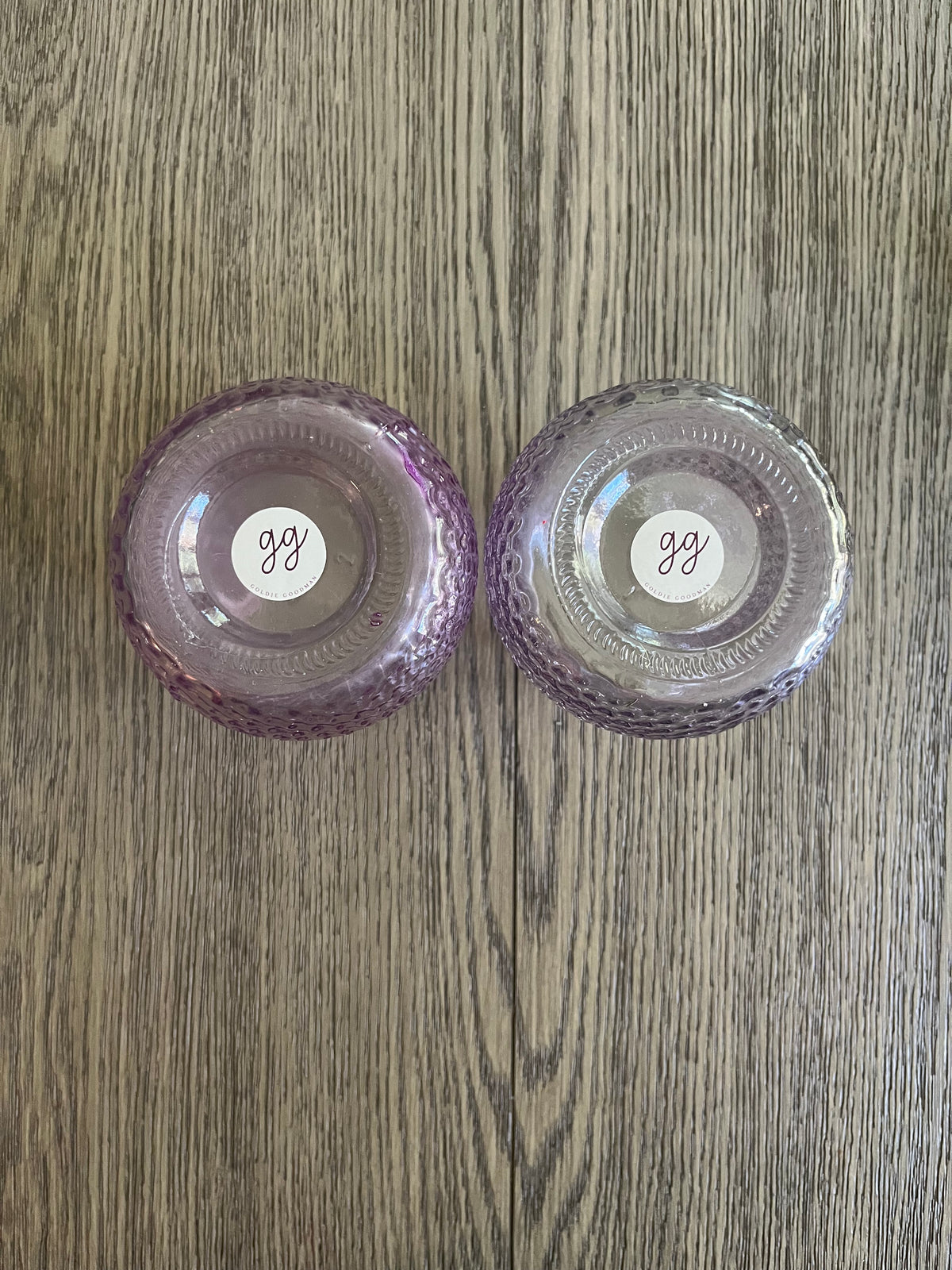 Pair of mauve glass vases with blueberry branches