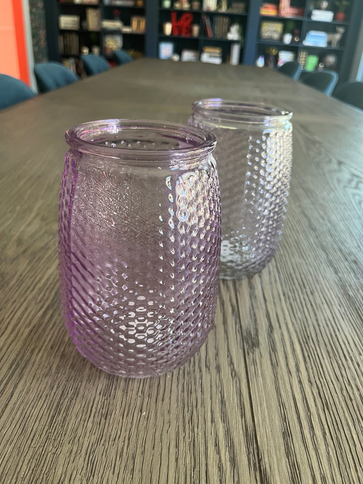 Pair of mauve glass vases with blueberry branches