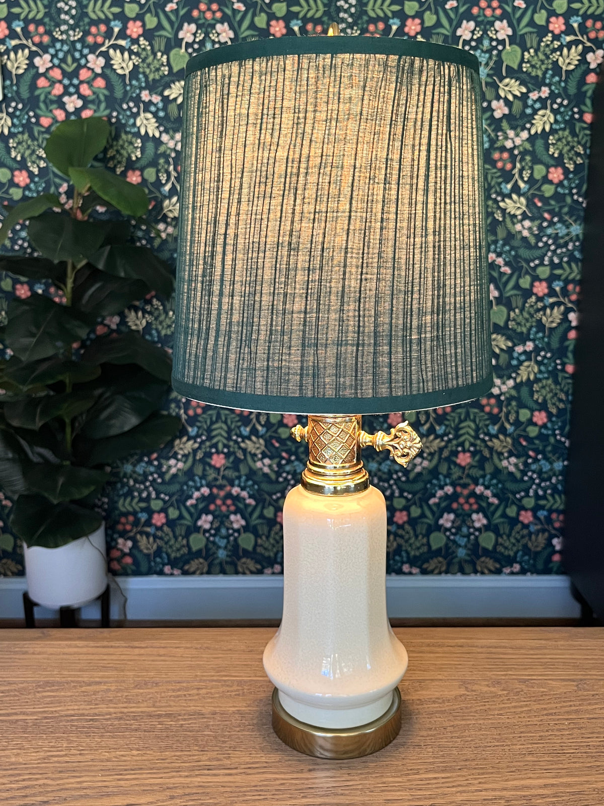 Vintage table lamp with a green pleated shade