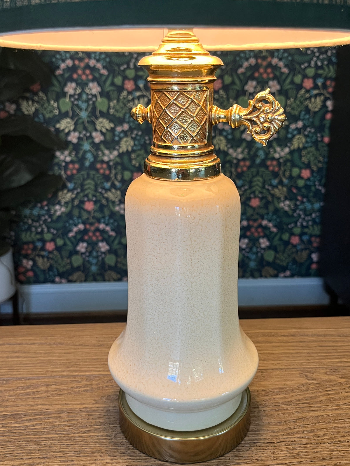 Vintage table lamp with a green pleated shade