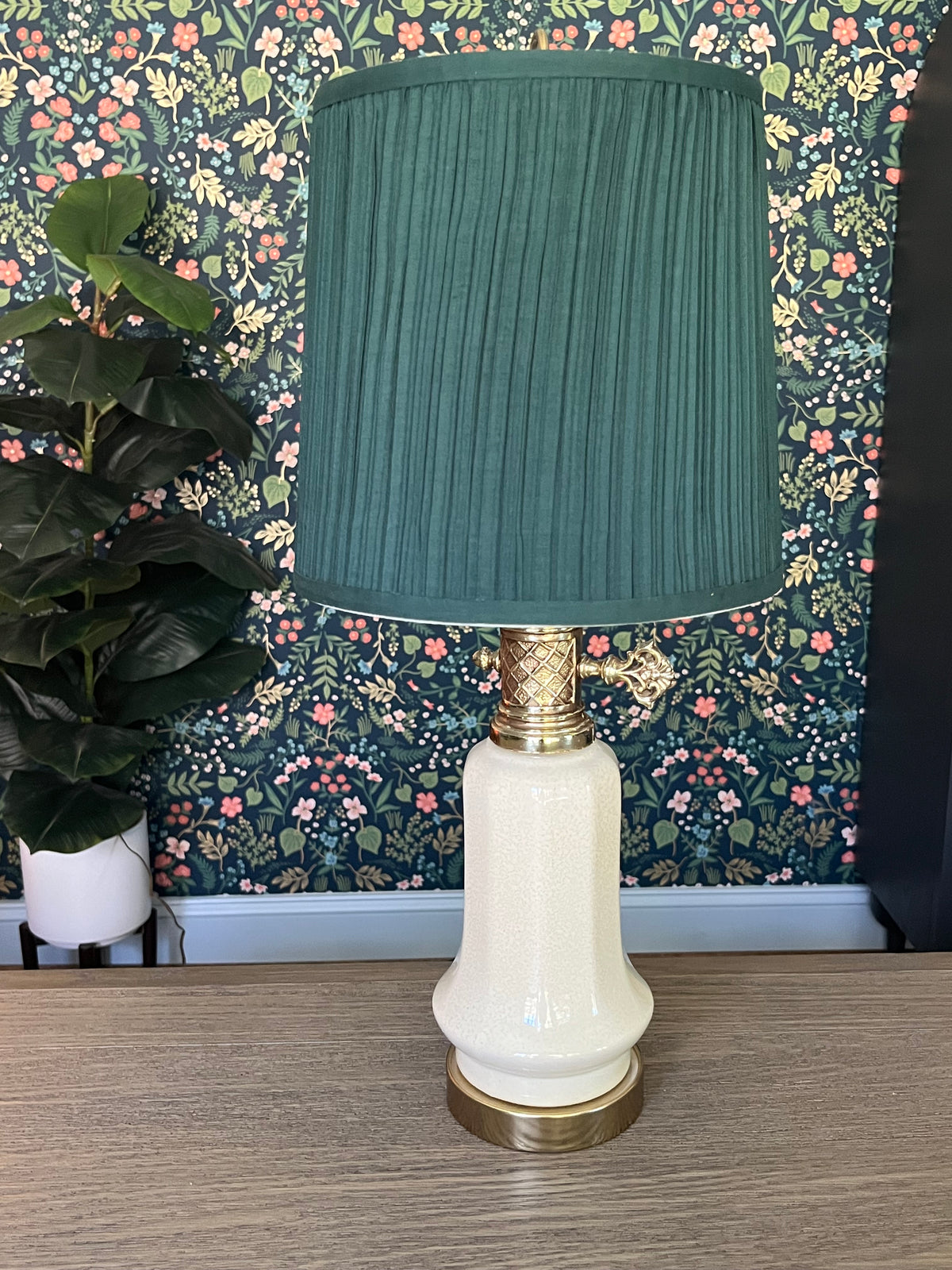 Vintage table lamp with a green pleated shade