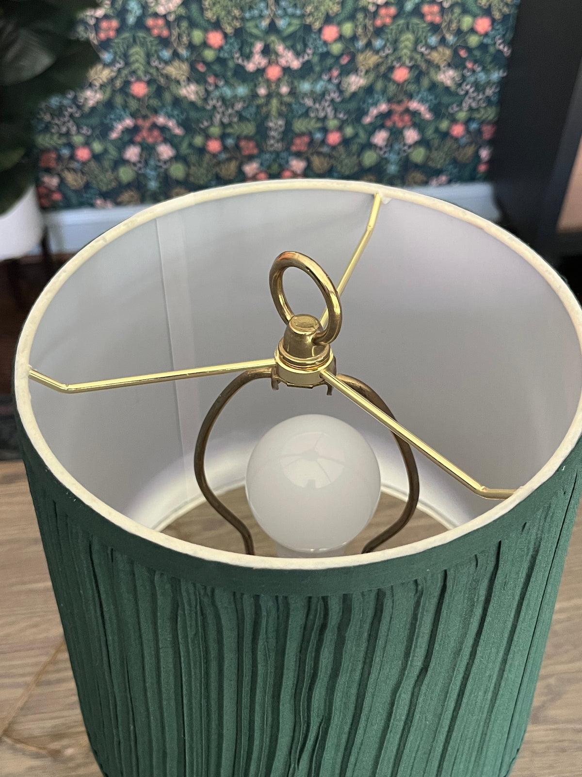 Vintage table lamp with a green pleated shade